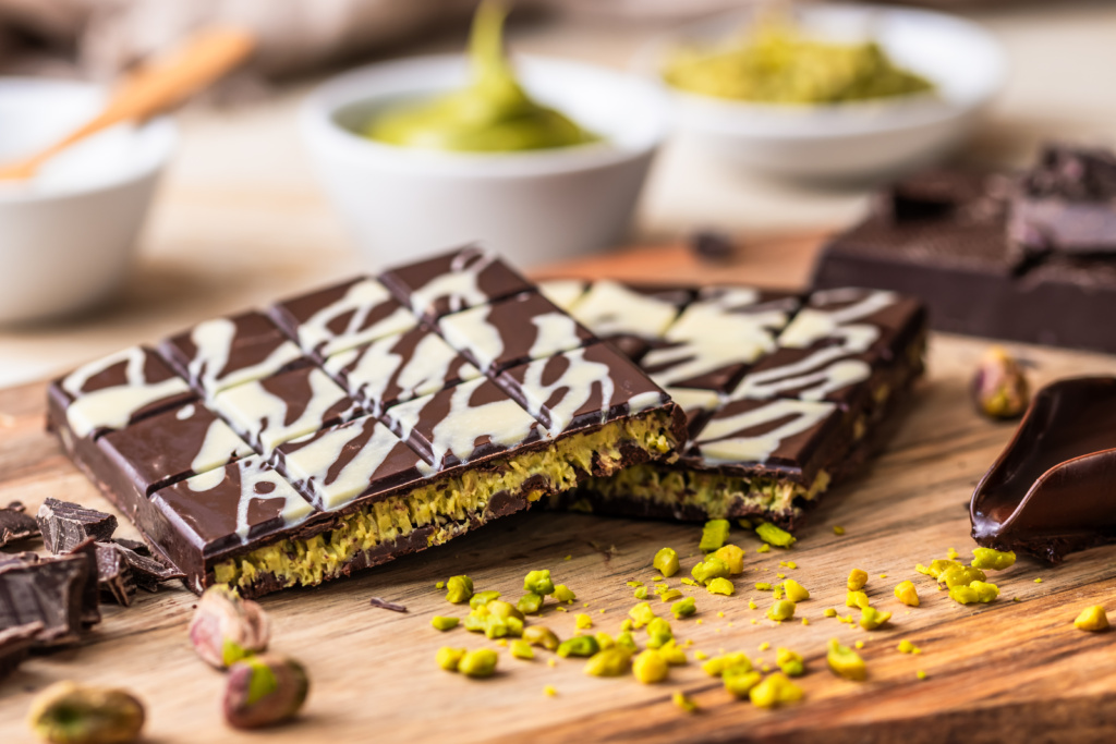 Homemade Dubai Chocolate With White And Dark Chocolate, Pistachio Cream, Kadayif And Pistachios On Wooden Background